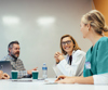 Three people having a conversation 