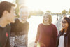 Four People Standing Smiling