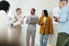 Professionals Standing Sharing Ideas