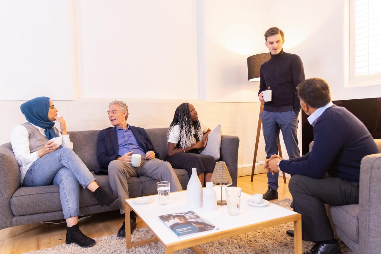 A Group Of People In Conversation