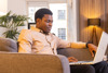 A man on a laptop sitting down