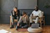 Three People Sitting Down