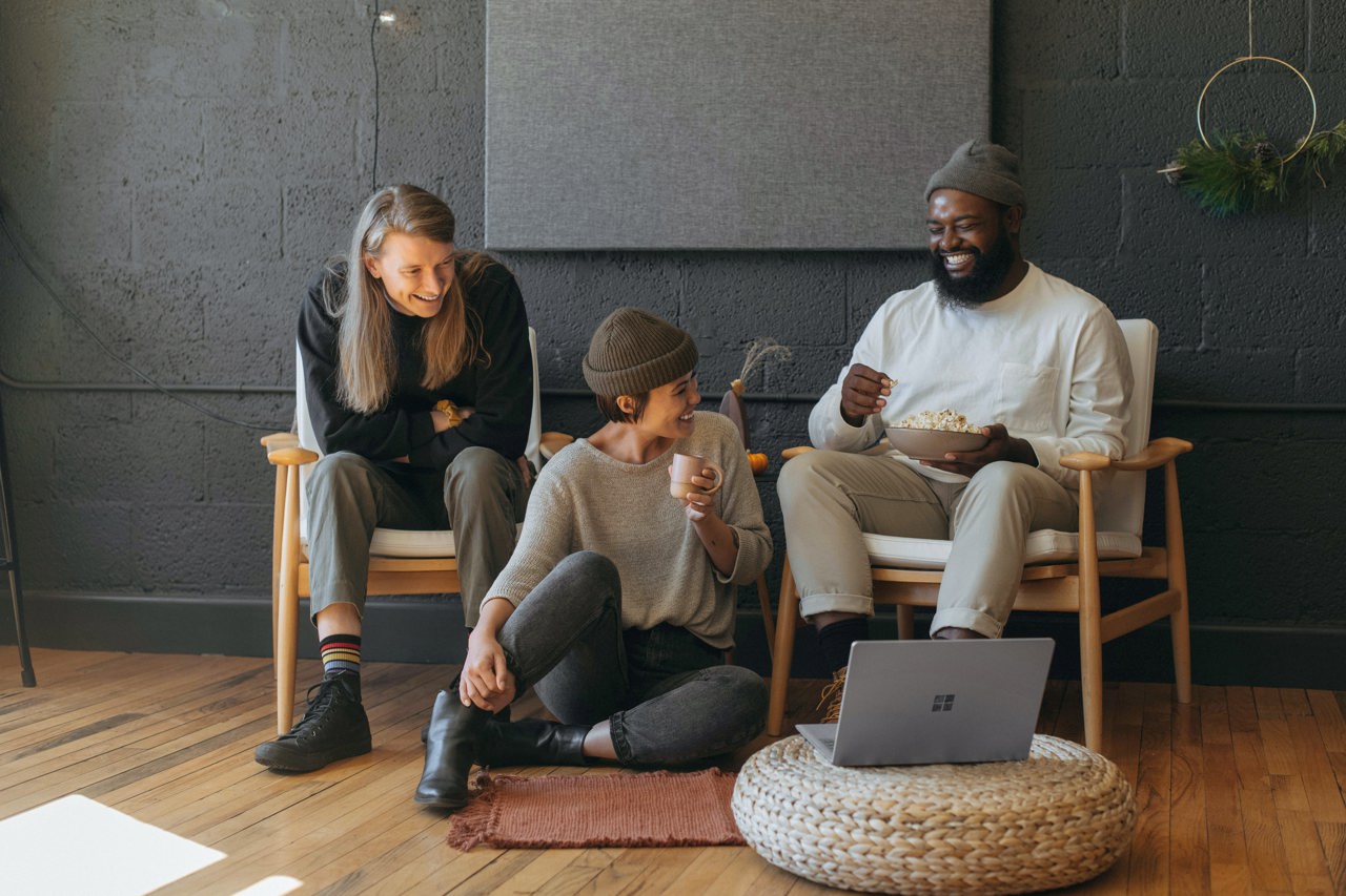 Three People Sitting Down