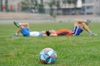 Athletes On Grass With A Football